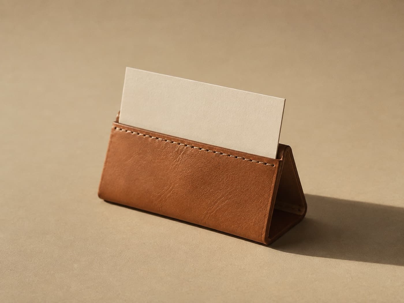 Card & Note Holder — A folded wedge with a slot along the top. Holds one card upright at reading angle.