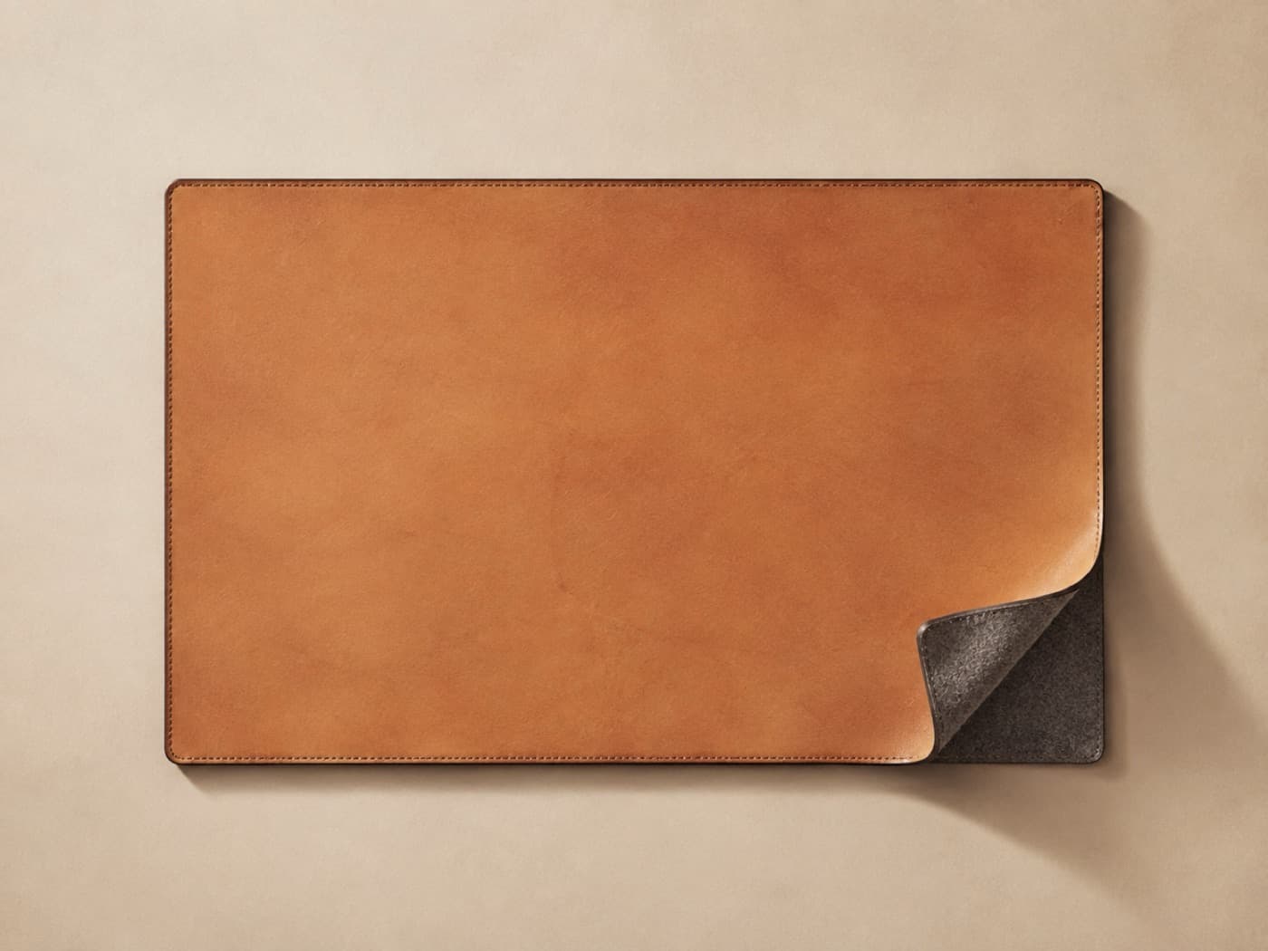 Desk Mat 60 × 35 — The small format. Fits a narrow writing desk or a shared table where the mat is your half of it.